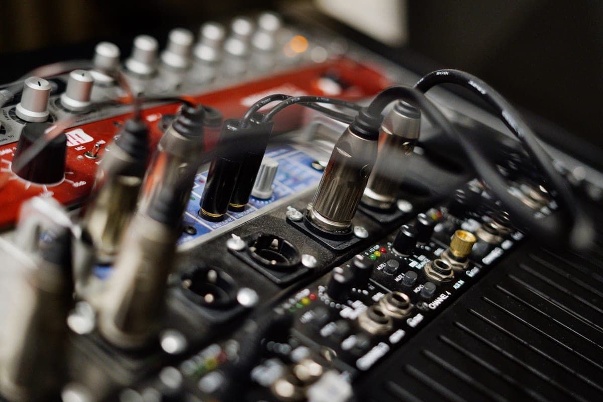 XLR cable ends and connectors laid out on a studio surface