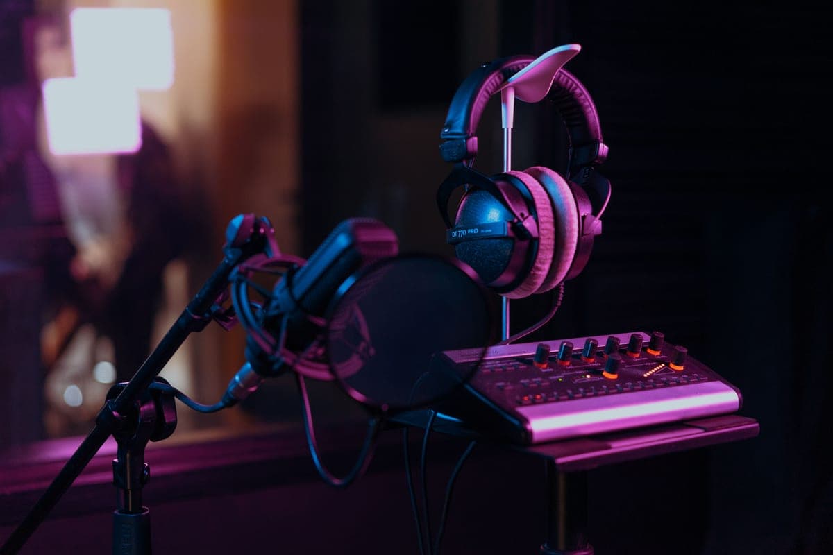 A desktop USB audio interface with gain knobs and an XLR input